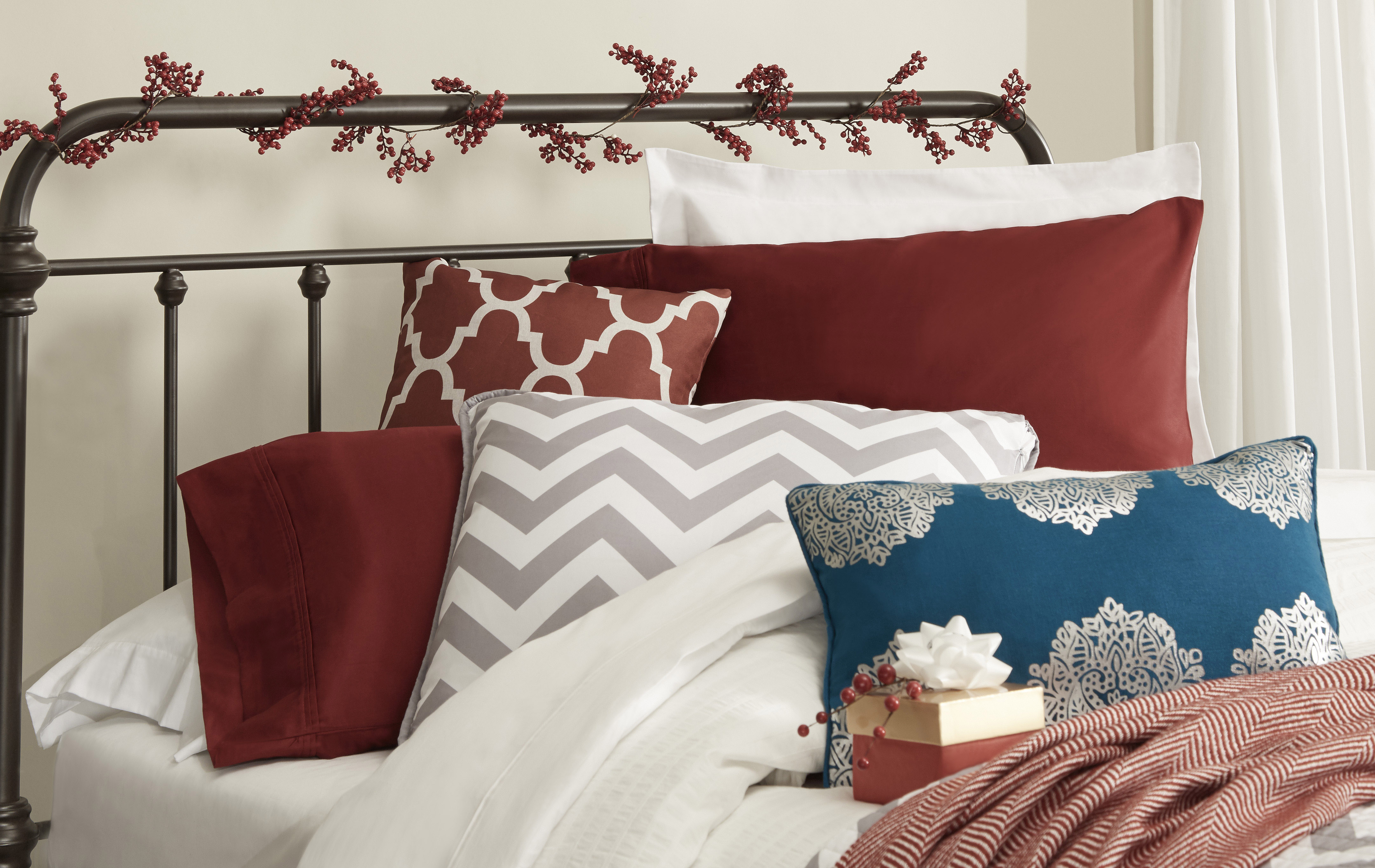 iNSPIRE Q decorative holiday headboard with faux berry vine tied around posts