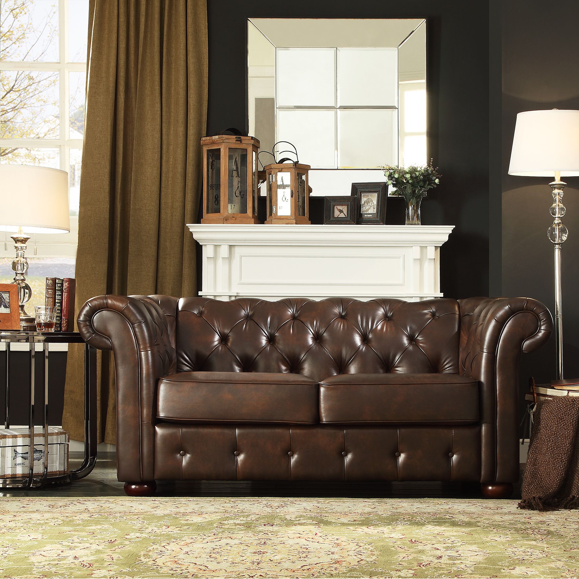 Moving on from faux leather is bonded leather. This image displays the Brown Bonded Leather Chesterfield Loveseat by iNSPIRE Q Artisan. In addition to the bonded leather upholstery, this piece also features button tufting and rolled arms to deliver a look of elegance.