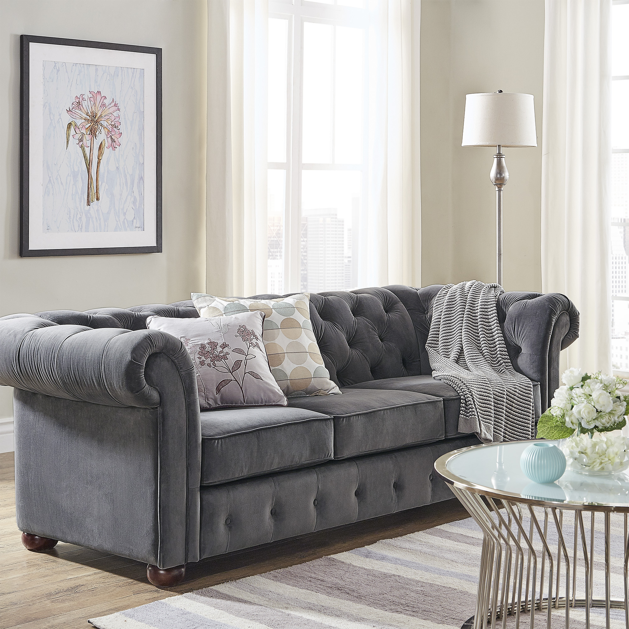 In this guide on how to buy furniture online, we wanted to show the different types of seating you could have in a living space. This image depicts the Dark Grey Velvet Chesterfield Sofa from iNSPIRE Q Artisan.