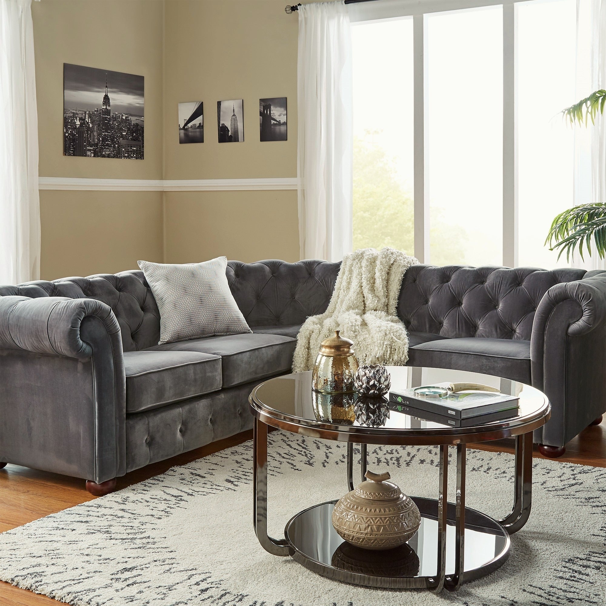 In this guide on how to buy furniture online, we wanted to show the different types of seating you could have in a living space. This image depicts the Dark Grey Velvet 5-Seat Chesterfield Sectional Sofa from iNSPIRE Q Artisan.